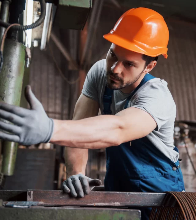 portrait-young-worker-hard-hat-large-waste-recycling-factory_146671-19578